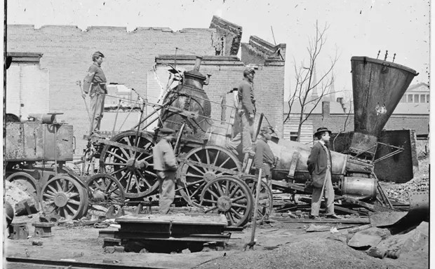 Civil War troops passing through a small town, 1864